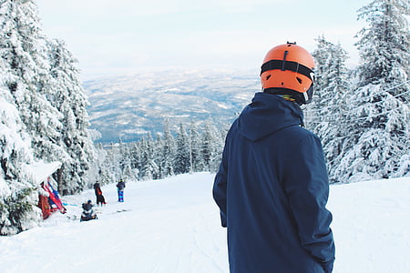 man wearing red helmet on snow field thumbnail