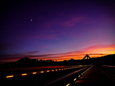 asphalt road during sunset thumbnail