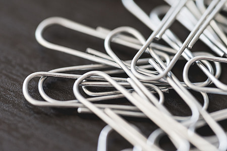Pile of Silver Paper Clips Close Up thumbnail