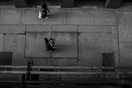 silhouette of two person on street on top view thumbnail