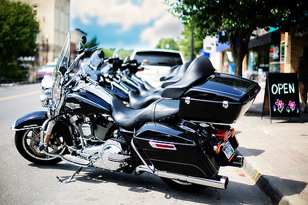 black touring motorcycles on street thumbnail