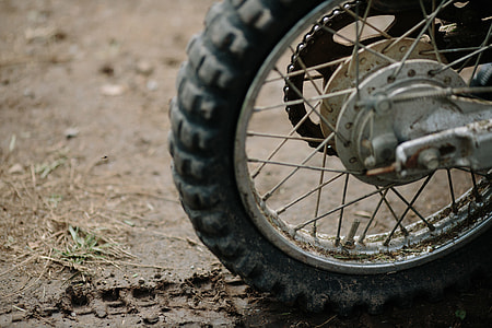 motorcycle wheel on muddy ground thumbnail