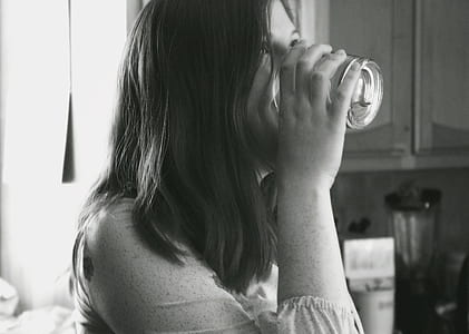 Grayscale Photo of Lady Drinking Water thumbnail