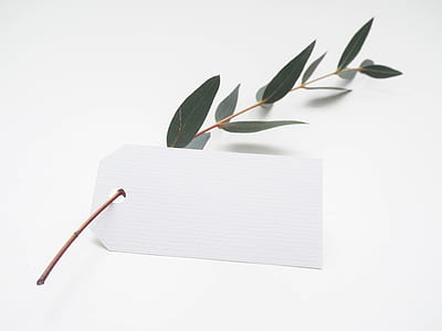 white product tag with green leaf thumbnail