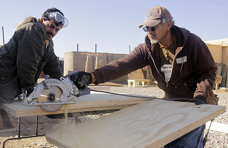 man using circular saw on cutting the board thumbnail