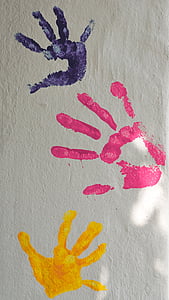 three hand prints on wall thumbnail