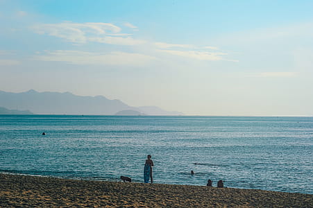 Person Standing on Seashore thumbnail