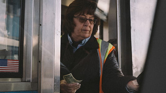 woman holding banknote thumbnail