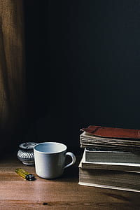 white ceramic mug on brown wooden table thumbnail