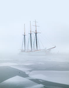 galleon ship surrounded by fog during daytime thumbnail