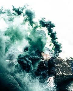 man carrying bottle with green smoke thumbnail