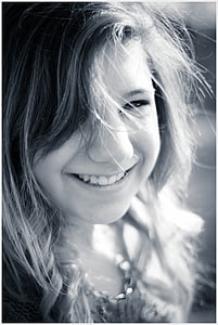 grayscale photo of woman while taking selfie thumbnail