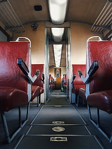 person taking photo of red vehicle seats thumbnail