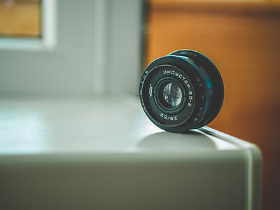 Selective Focus Photography of Black Telephoto Lens on White Table thumbnail