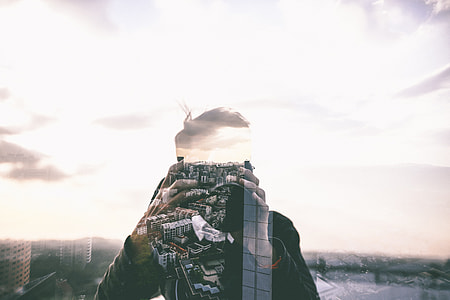 double exposure photography of man taking photo thumbnail