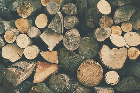 piled brown firewood lot thumbnail