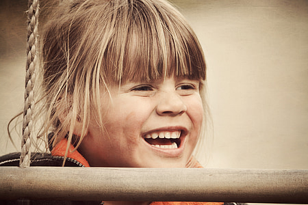 smiling girl behind wood and rope thumbnail