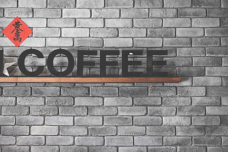 black Coffee signage on wall thumbnail