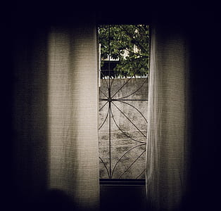 brown curtain beside pane window thumbnail