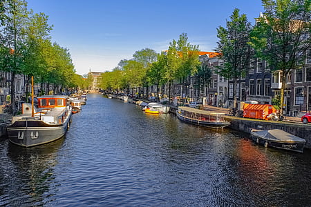 boats on body of water near buildings thumbnail