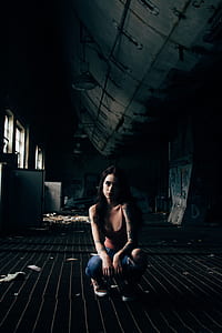woman wearing red tank top sitting thumbnail