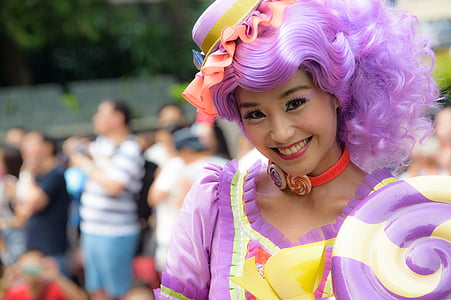 smiling woman in purple and yellow dress during daytime thumbnail