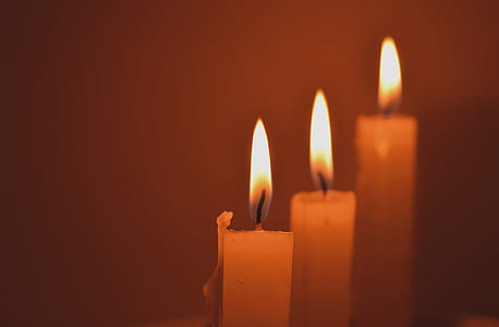 three lighted taper candles closeup photography thumbnail