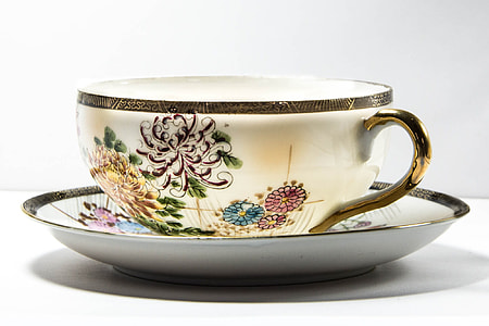 white and multicolored floral ceramic teacup thumbnail