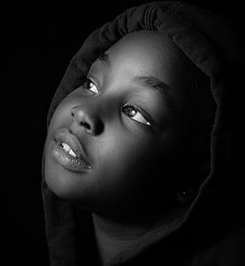 grayscale photo of boy wearing hoodie jacket thumbnail