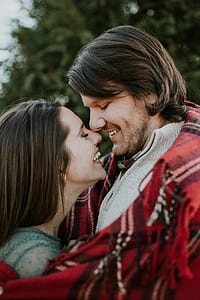 man and woman smiling facing each other thumbnail