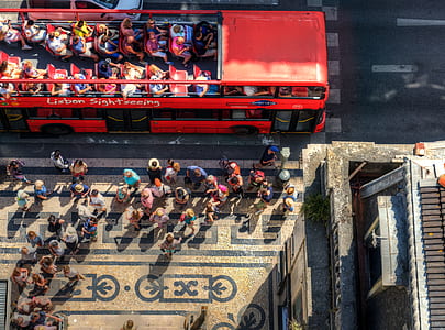 birds's-eye view photo of people near the double decker bus thumbnail