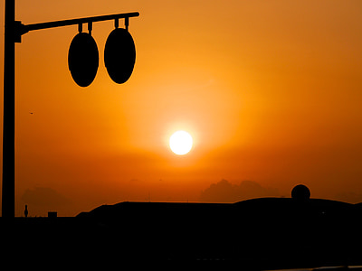 silhouette photo of round metal frame during golden hour thumbnail