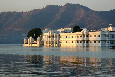 white concrete building near body of water thumbnail