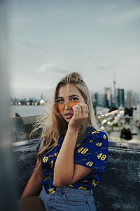 Woman With Yellow Glasses Photo thumbnail