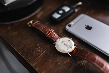 Apple iPhone 6 and Vintage watch on a brown leather wallet thumbnail