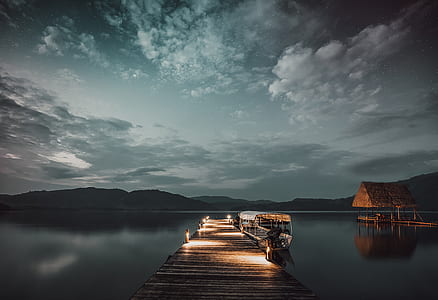 brown dock surrounded with body of water thumbnail
