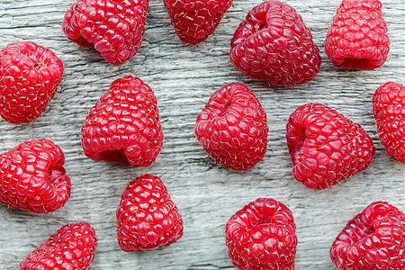 bunch of raspberries on gray surface thumbnail