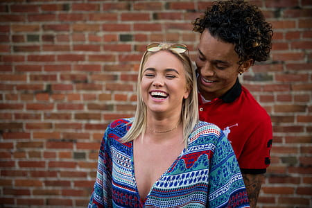 man and woman standing taking selfie thumbnail