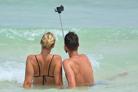 man and woman taking a photo during daytime thumbnail