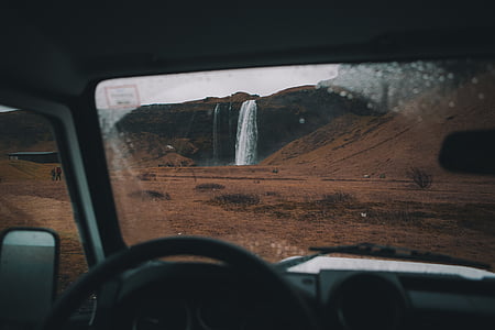 waterfalls near brown surface at daytime thumbnail