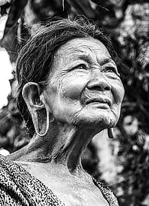 grayscale photograph of a woman wearing black and white top thumbnail
