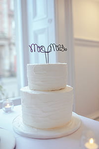 shallow focus photography of white icing covered 2-layer cake thumbnail