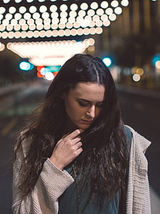 woman holding her hair thumbnail