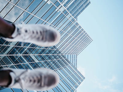 selective focus photography of high-rise glass building thumbnail