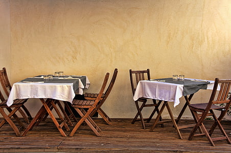 two brown wooden dining table with two chairs thumbnail