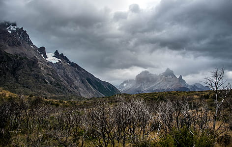 brown mountain under gray clouds thumbnail