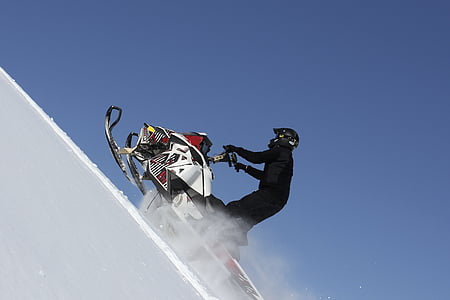 man riding snowmobile thumbnail