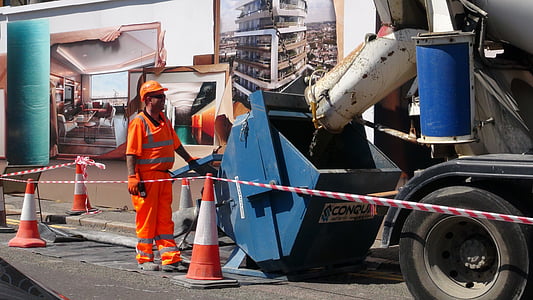 man standing near concrete mixer truck on outdoors thumbnail