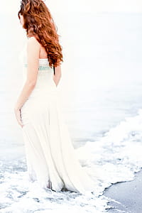 woman standing on beach shore thumbnail