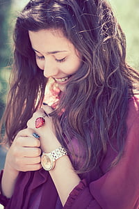 woman in red shirt looking on the ground thumbnail